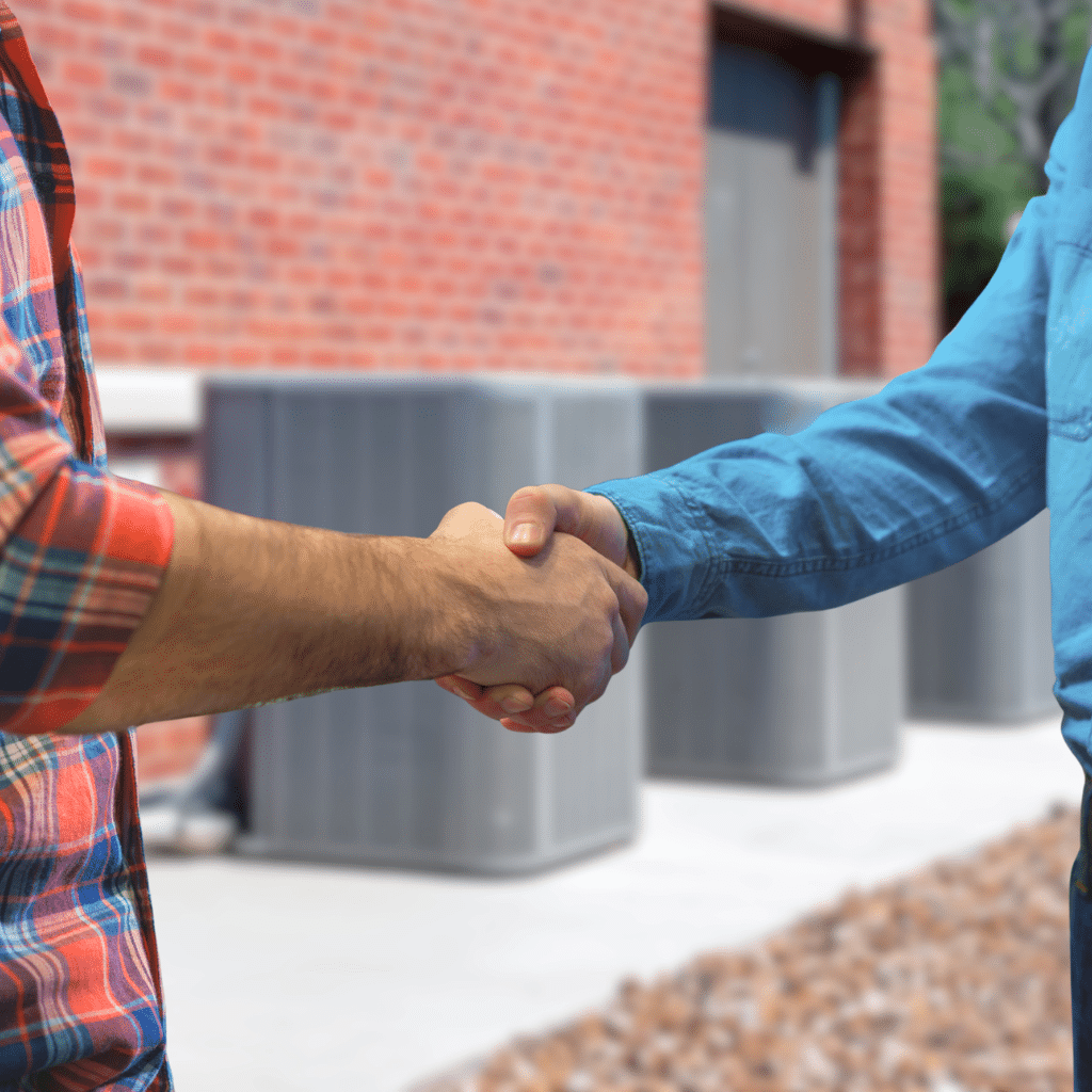HVAC tech and customer handshake